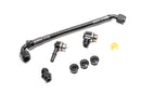 Stock photo of a black Radium Fuel Rail with fittings.