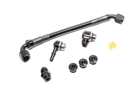 Stock photo of a black Radium Fuel Rail with fittings.
