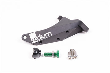 Stock photo of a black Radium Master Cylinder Brace, 2015+ Subaru Wrx and STi with green, metal hardware. 