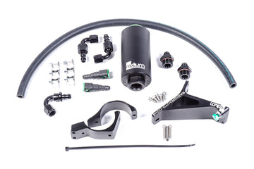 Stock photo of a black, metal Radium Fuel Filter, Microglass, for early Subarus with green accents.