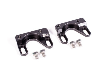 Stock photo of a black, metal Radium Fuel Rail Adapter for Subaru EJ207 and 2.5I EJ253 engines.