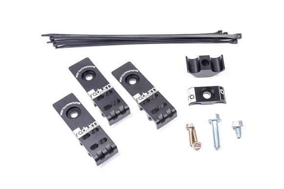 Stock photo of a black, metal Radium Fuel Line Retaining Kit for 2008 - 2021 Subaru.