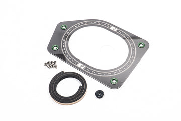 Stock photo of a black, metal Radium Mazda FD RX7 Fuel Pump Access Cover with green accents.