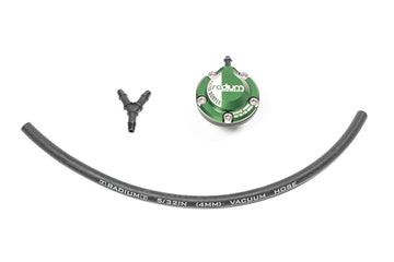 Stock photo of a green, metal Radium FPD-R Fuel Pulsation Damper 8AN ORB