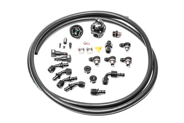 Stock photo of Radium Subaru EJ Series Fuel Rail Plumbing Kit with black, metal fittings. 