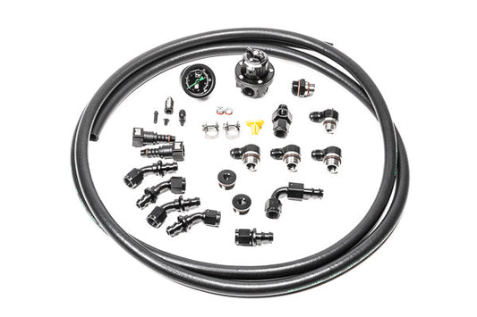 Stock photo of Radium Subaru EJ Series Fuel Rail Plumbing Kit with black, metal fittings. 