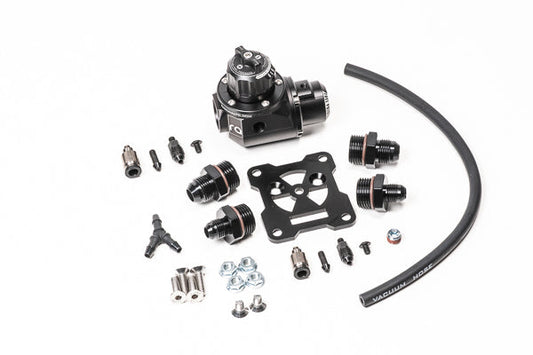 Stock photo of a black, metal Radium Fuel Pressure Regulator-Damper kit. 
