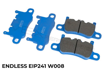 Endless performance front brake pads for street and track use on Porsche 911 with blue backing plates.