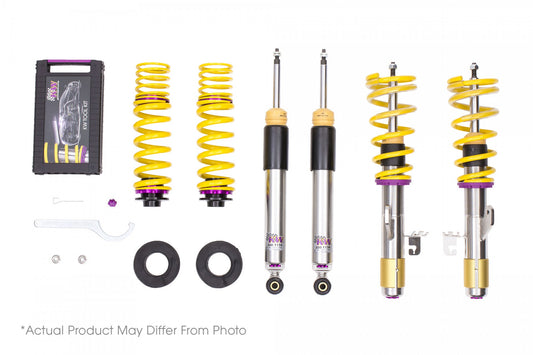 A set of KW V3 Coilovers for Toyota GR Corolla, displaying yellow springs, black and silver shock absorbers, adjustment tools and rebound and compression damping adjustability.