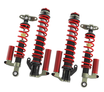 Samsonas stainless steel rally coilovers for Toyota GR Yaris with red springs and external reservoirs.