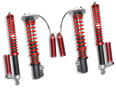 Samsonas stainless steel rally coilovers for Volkswagen Golf mark 3s with red springs and external reservoirs.