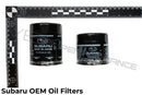 Top down shot of OEM Made-in-Japan Subaru oil filters with ruler for reference.