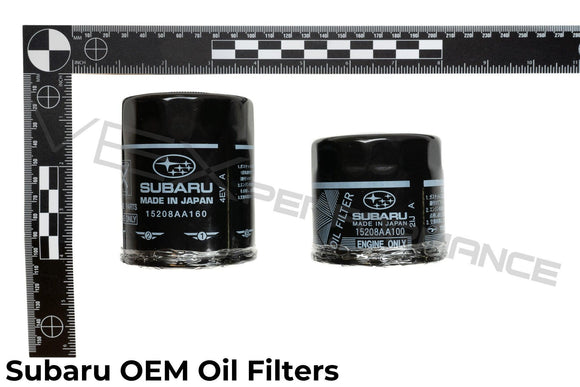 Top down shot of OEM Made-in-Japan Subaru oil filters with ruler for reference.