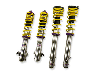 KW V1 high-performance stainless steel coilover suspension system for 2002-2003 Subaru WRX models with yellow springs and purple hardware.
