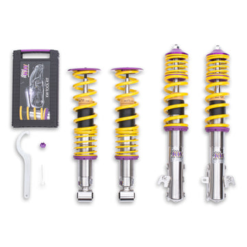 KW V1 high-performance stainless steel coilover suspension system for 2015-2021 Subaru WRX STis with yellow springs and purple hardware.
