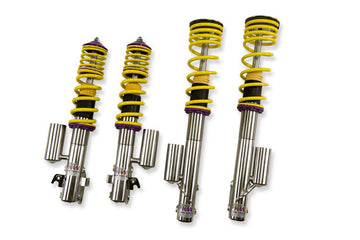 KW V3 high-performance stainless steel coilover suspension system for 2002-2003 Subaru WRX STi models with external piggyback reservoirs, yellow springs and purple hardware.
