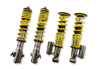 KW V3 high-performance coilover kit for 2010-2014 Subaru Legacy with yellow springs and purple hardware.