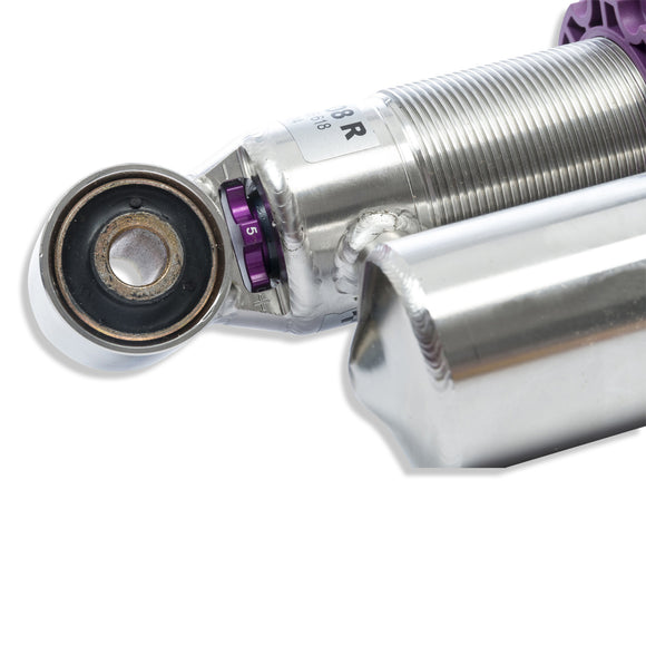 Close up shot of the compression adjustment knob on the rear coilover.