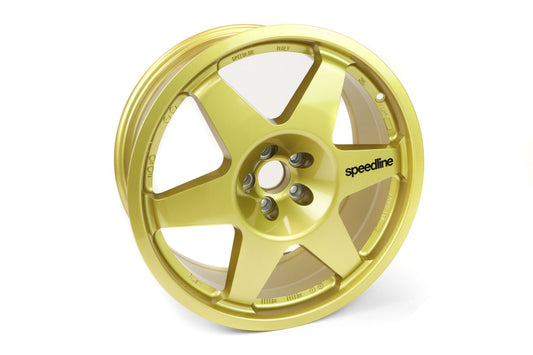 Gold Speedline Corse 2013C wheel with black branding for rally applications. 